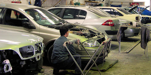 Cars being repaired in the Newbridge workshop