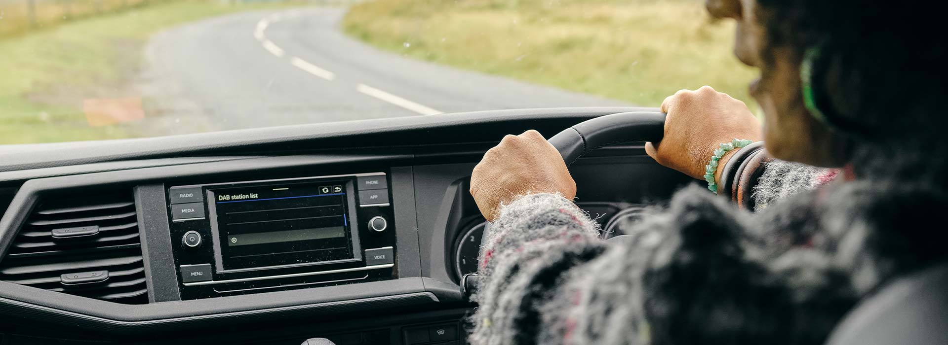Driver at the wheel of a car on the road